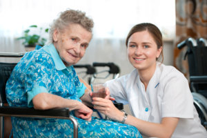 Elderly woman with nurse